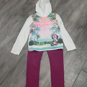 A Disney zip up jacket and a pair of jordache pant